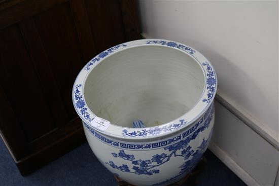 Two Chinese blue and white fish bowls on stands